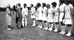 Myrtle Maclagan with unidentified players and guest at Cricket Week 1949 from her photo album